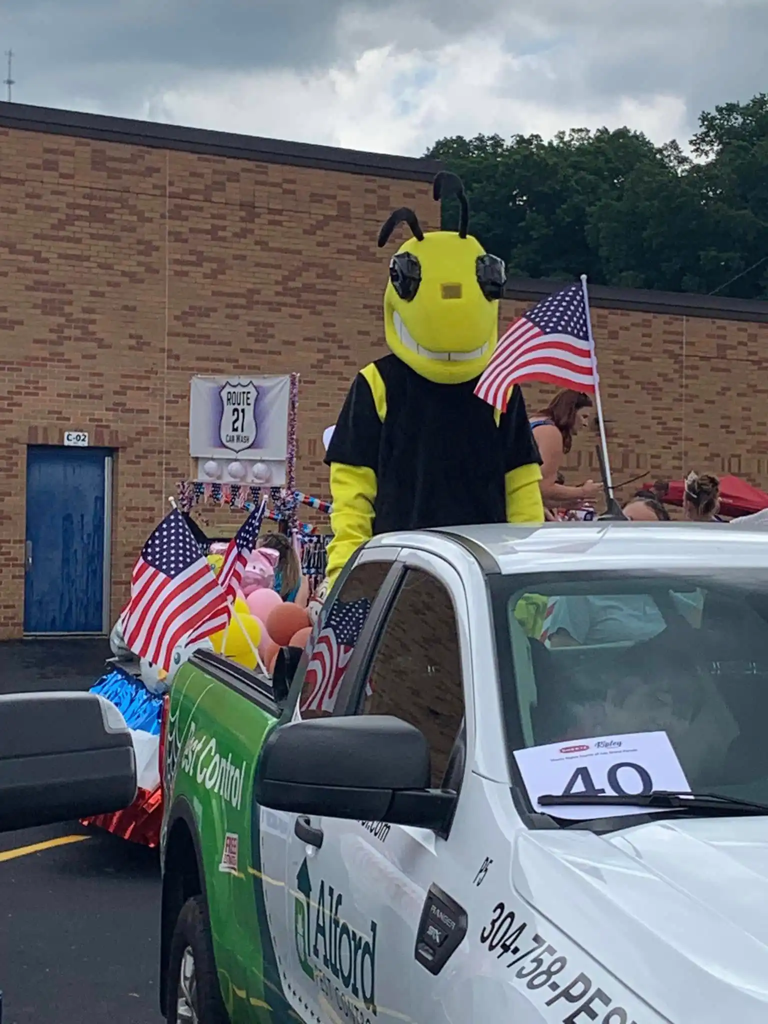 Alford's Ripley the bee mascot on the parade truck