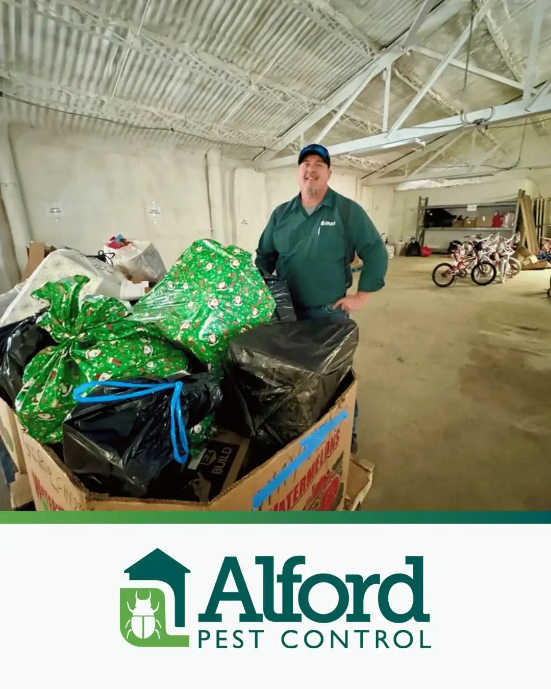 Alford volunteer with wrapped gifts at the Union Mission Foster Care Toy Event