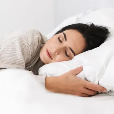 woman sleeping peacefully in bed bug free bed